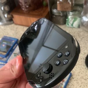 Ps-Vita console with Hard case and Games